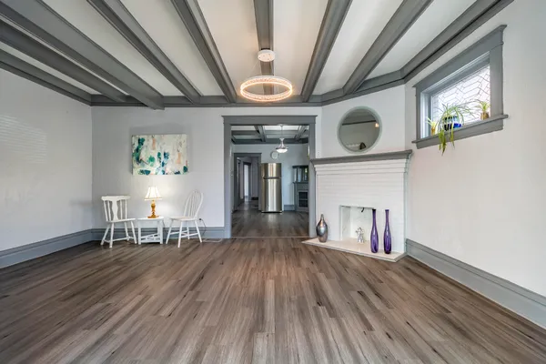 a view of livingroom with hardwood floor and a ceiling fan
