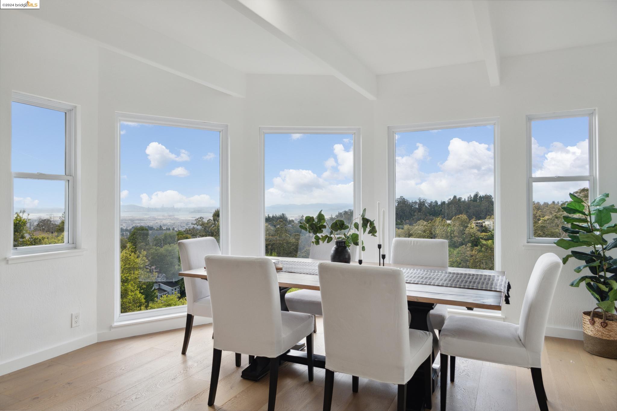 a view of a dining room with furniture window and outside view
