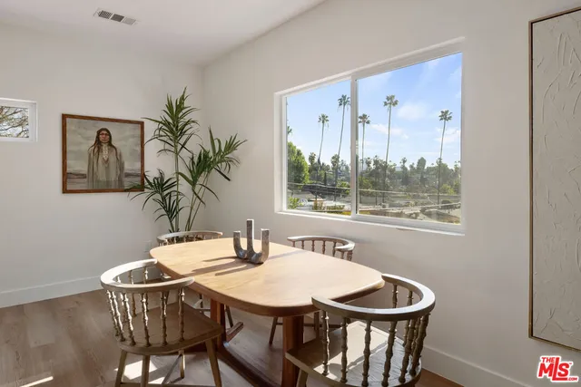 a kitchen with stainless steel appliances a refrigerator a stove and a microwave