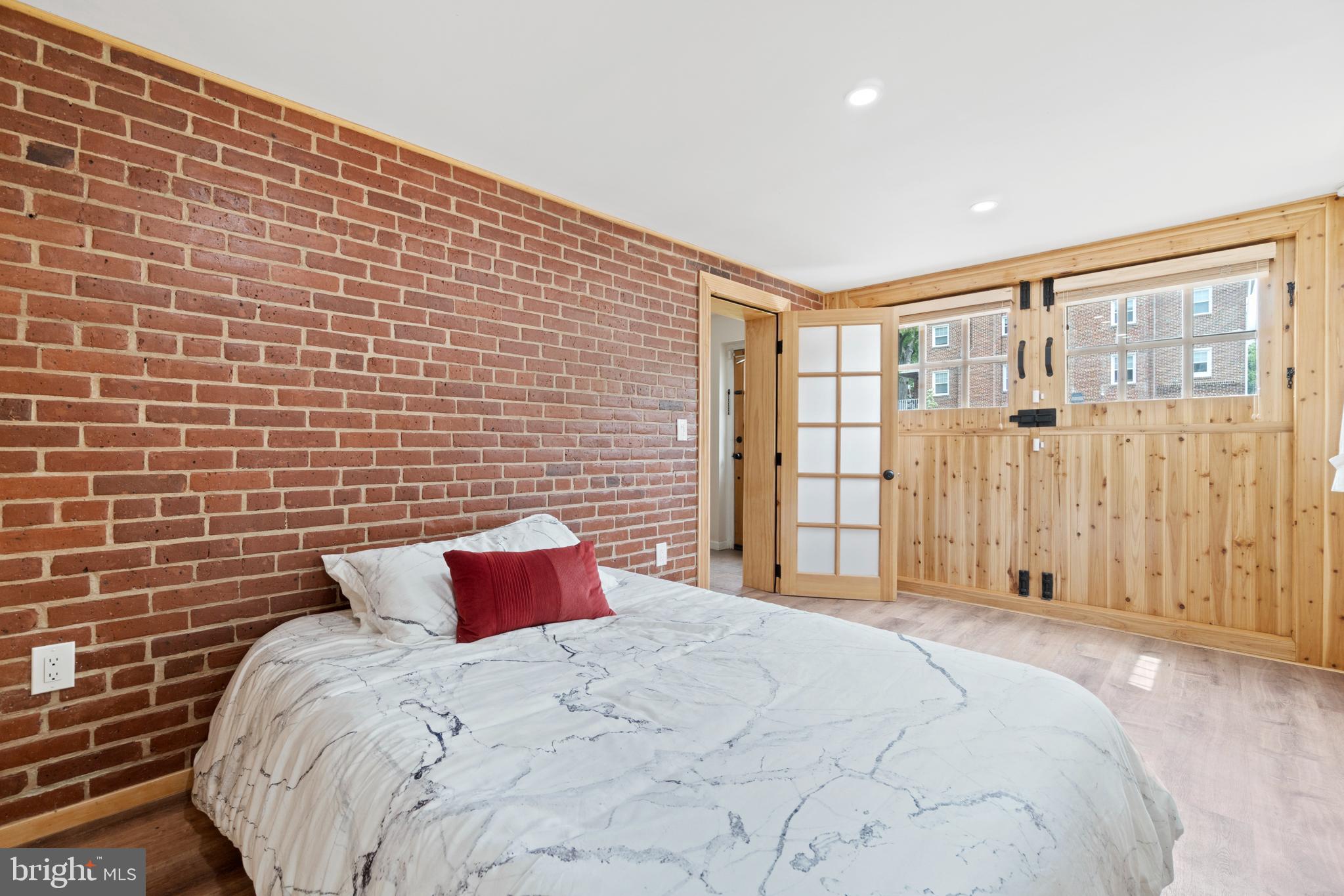 441 21st Street Northeast, Unit B Washington, DC 20002 - Photo 21 of 23 Bedroom with exposed brick wall that was restored!