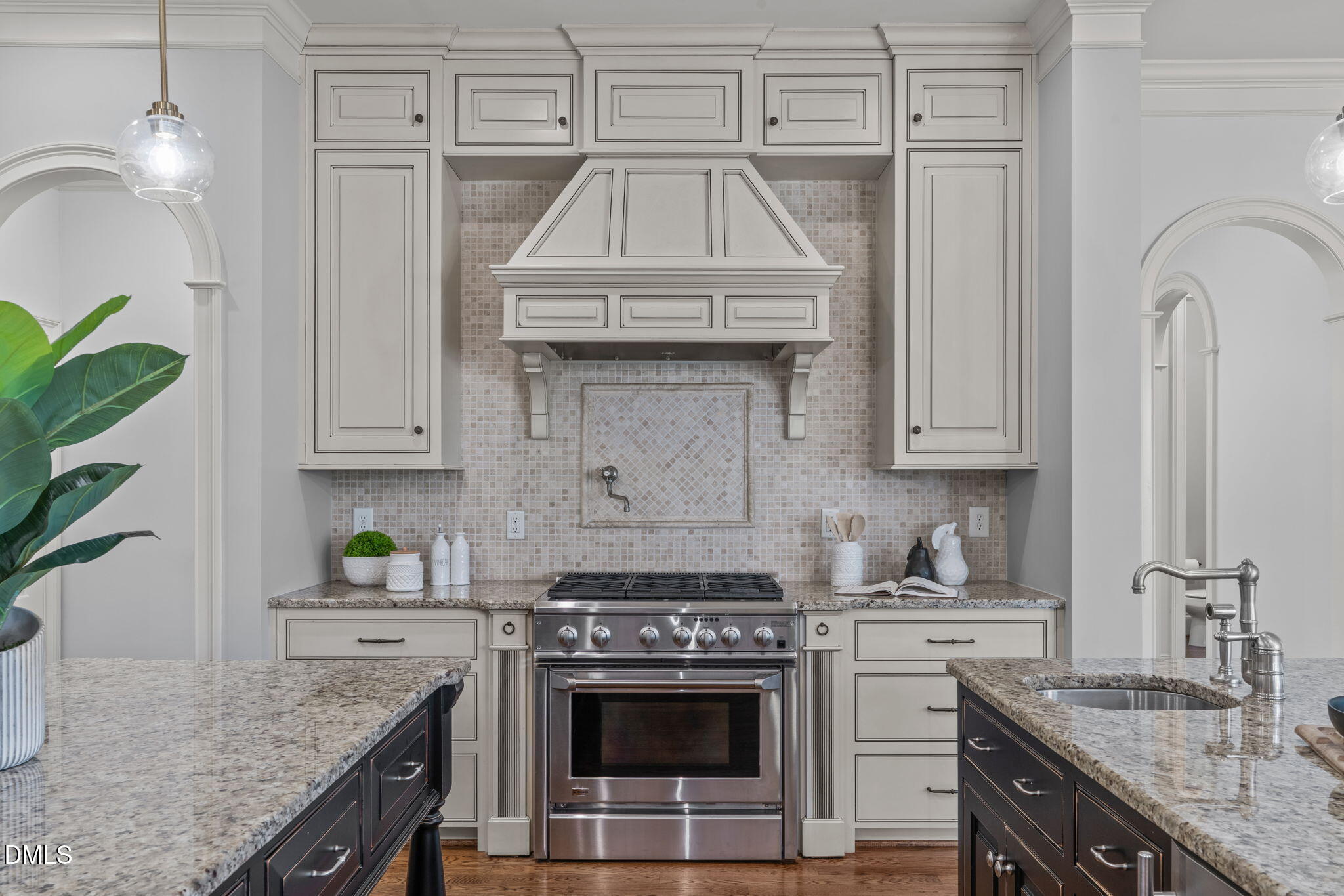3005 Greyhawk Place Apex, NC 27539 - Photo 33 of 88 a kitchen with granite countertop a sink stove and cabinets
