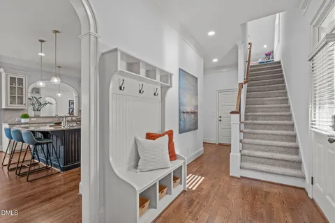 a bathroom with a shower curtain and a window