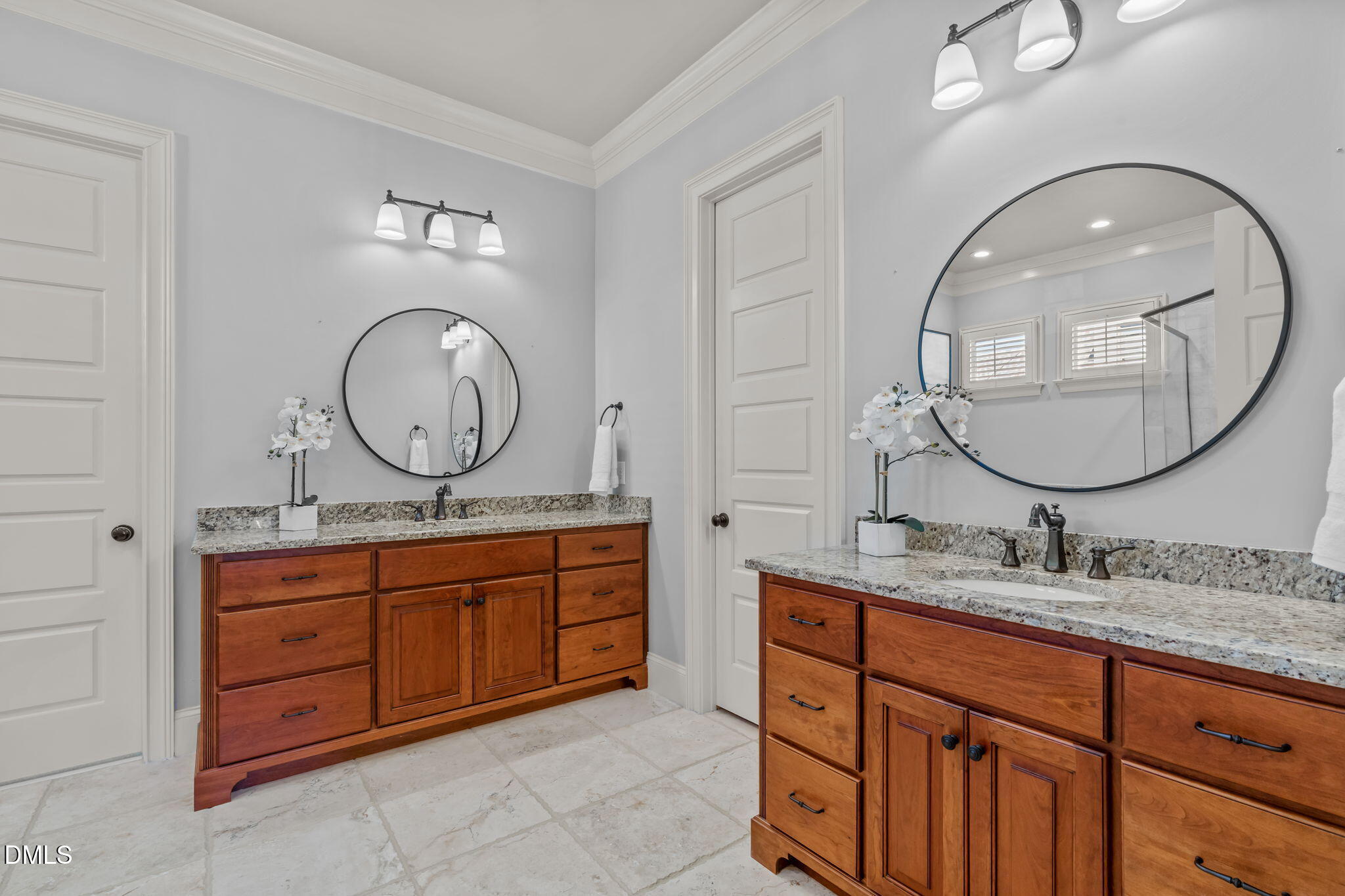3005 Greyhawk Place Apex, NC 27539 - Photo 46 of 88 a bathroom with a granite countertop double vanity sink and a mirror