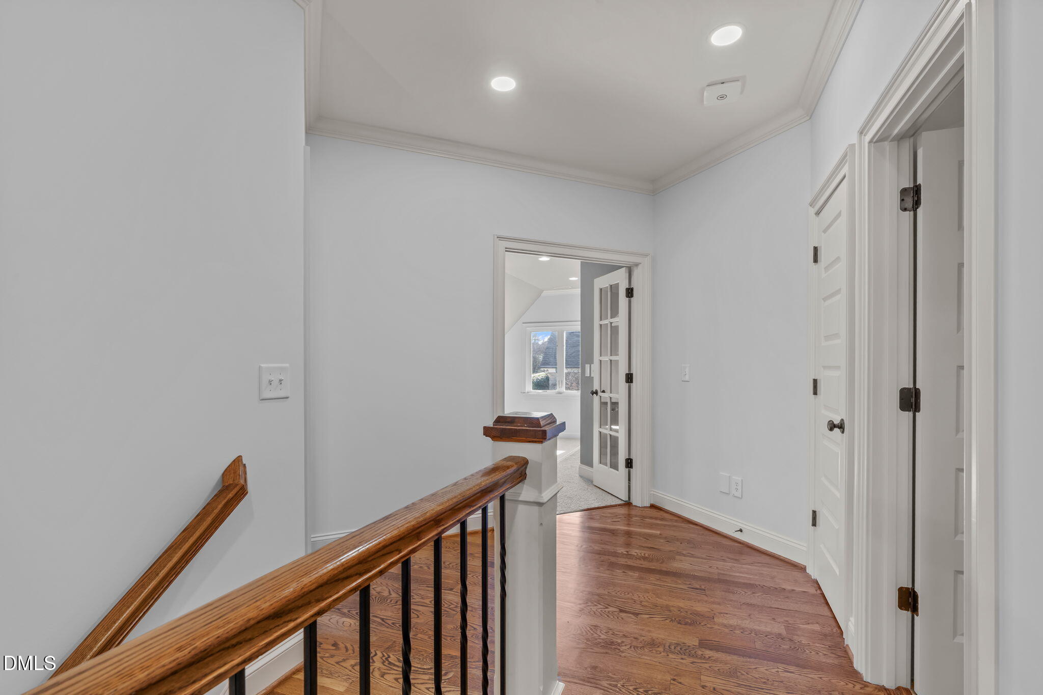 3005 Greyhawk Place Apex, NC 27539 - Photo 49 of 88 a view of a hallway with wooden floor and staircase