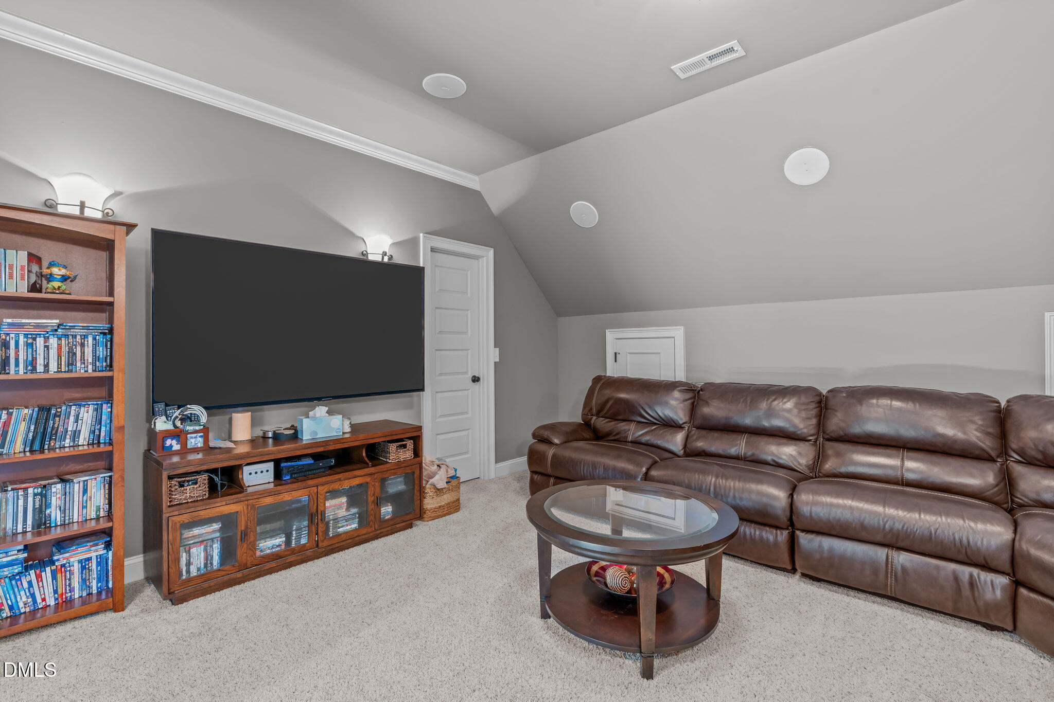 3005 Greyhawk Place Apex, NC 27539 - Photo 54 of 88 a living room with furniture and a flat screen tv