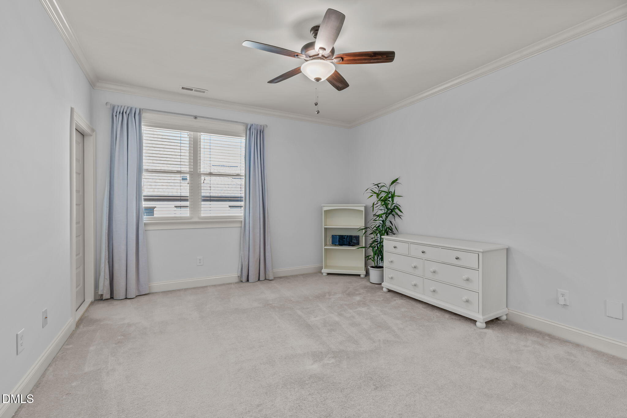 3005 Greyhawk Place Apex, NC 27539 - Photo 60 of 88 a view of a room with cabinet and a ceiling fan