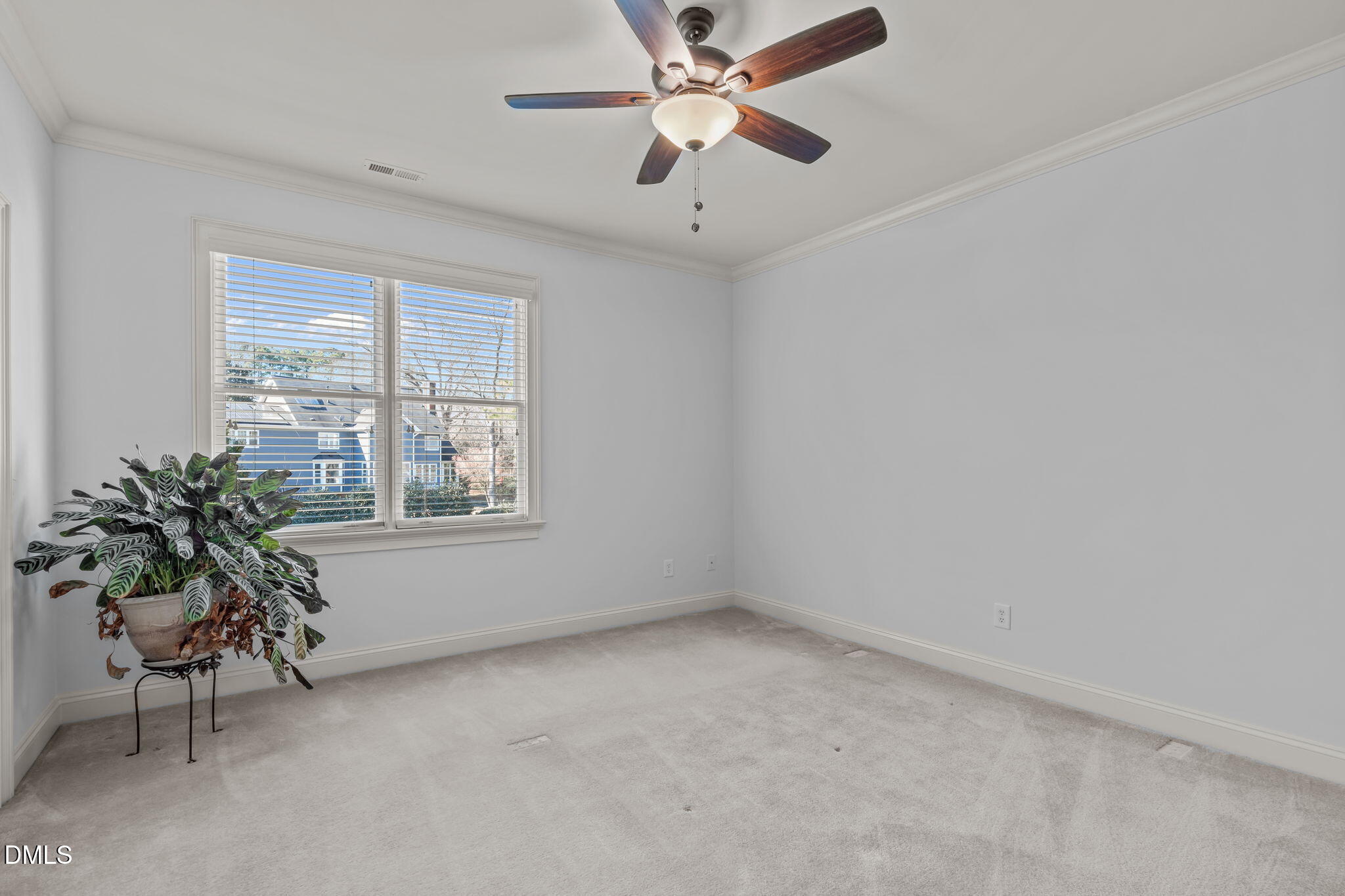 3005 Greyhawk Place Apex, NC 27539 - Photo 61 of 88 an empty room with windows and ceiling fan