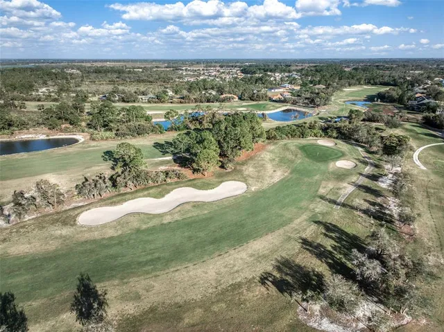 a living room with fireplace furniture and a large window