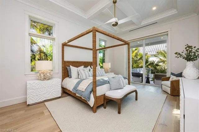 a bedroom with a bed couch and table