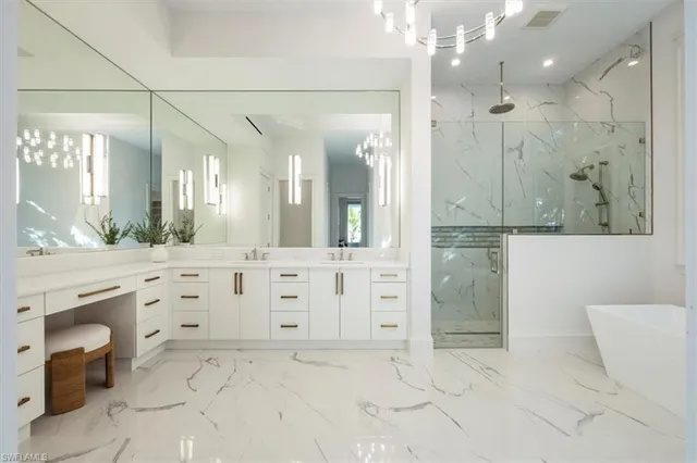 a bathroom with a shower sink and mirror