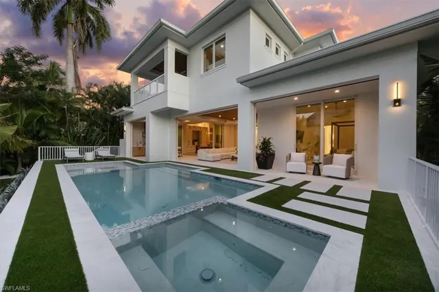 a view of a house with swimming pool