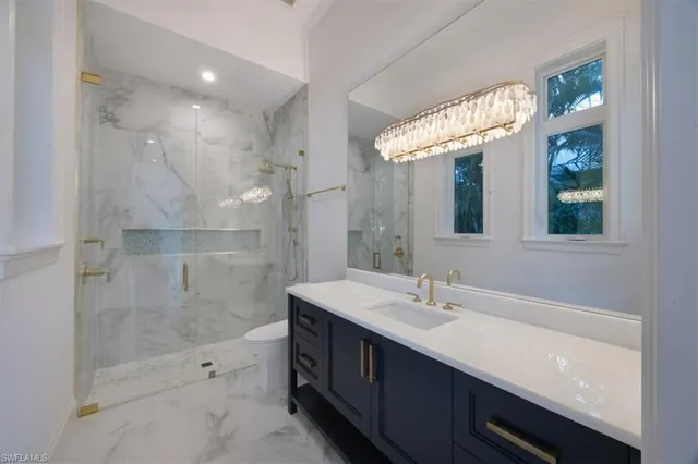 a bathroom with a double vanity sink mirror and shower