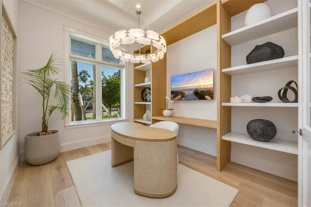 a dining room with furniture and chandelier