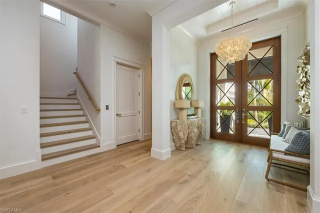 a view of an empty room and glass door
