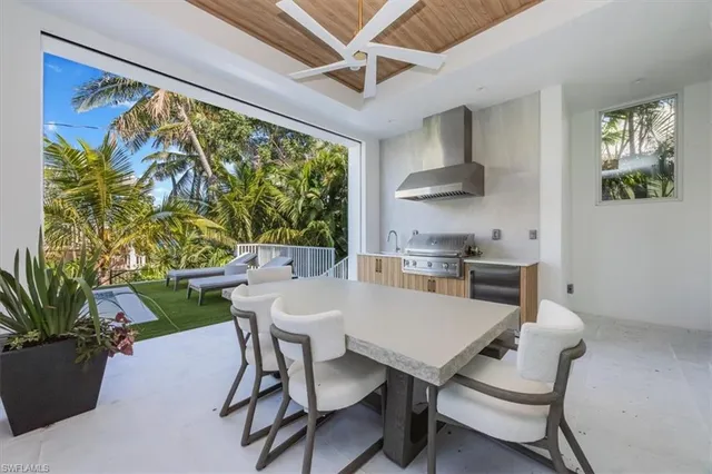 a kitchen with a table and chairs in it