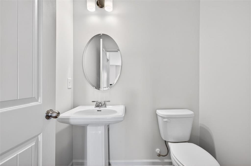 704 Sinclair Lane Temple, GA 30179 - Photo 23 of 37 a bathroom with a toilet sink and mirror