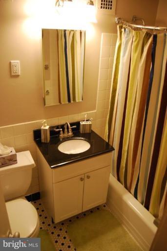 1311 Delaware Avenue Southwest, Unit S147 Washington, DC 20024 - Photo 12 of 18 a bathroom with a sink toilet and shower