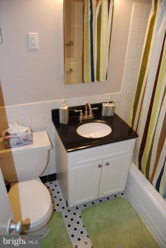 1311 Delaware Avenue Southwest, Unit S147 Washington, DC 20024 - Photo 13 of 18 a bathroom with a sink and a mirror