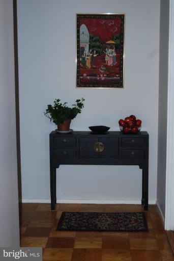 1311 Delaware Avenue Southwest, Unit S147 Washington, DC 20024 - Photo 15 of 18 a view of table with painting on the wall