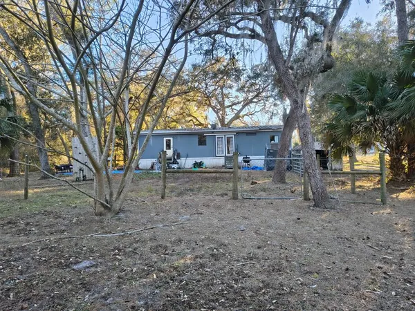 a house view with a backyard space