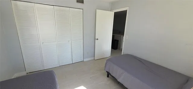 a room with pool table and chairs