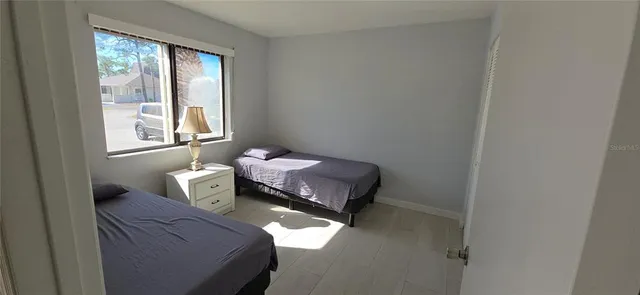 a hallway with a bench and a couch