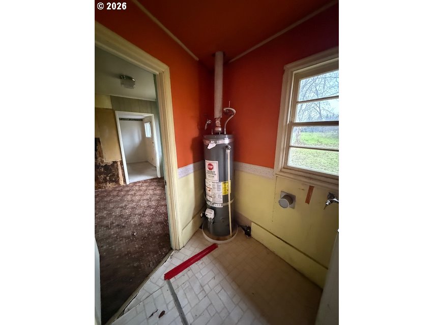 381 Gregory Drive Winston, OR 97496 - Photo 12 of 20 a room with a door open and a microwave