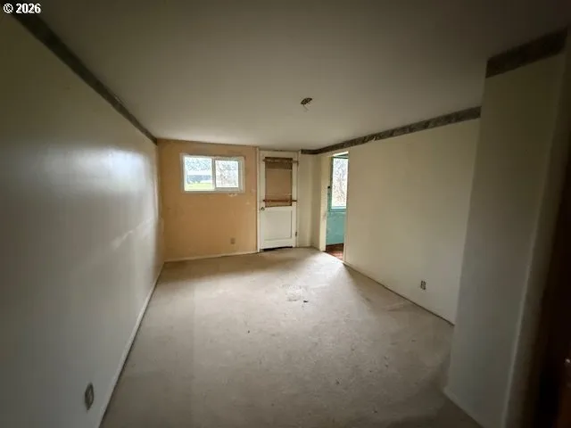 a view of an empty room and window