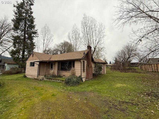 381 Gregory Drive Winston, OR 97496 - Photo 3 of 20 a front view of house with yard and trees
