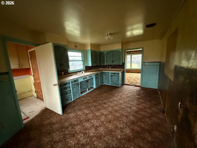 381 Gregory Drive Winston, OR 97496 - Photo 10 of 20 a kitchen with stainless steel appliances a refrigerator and a sink