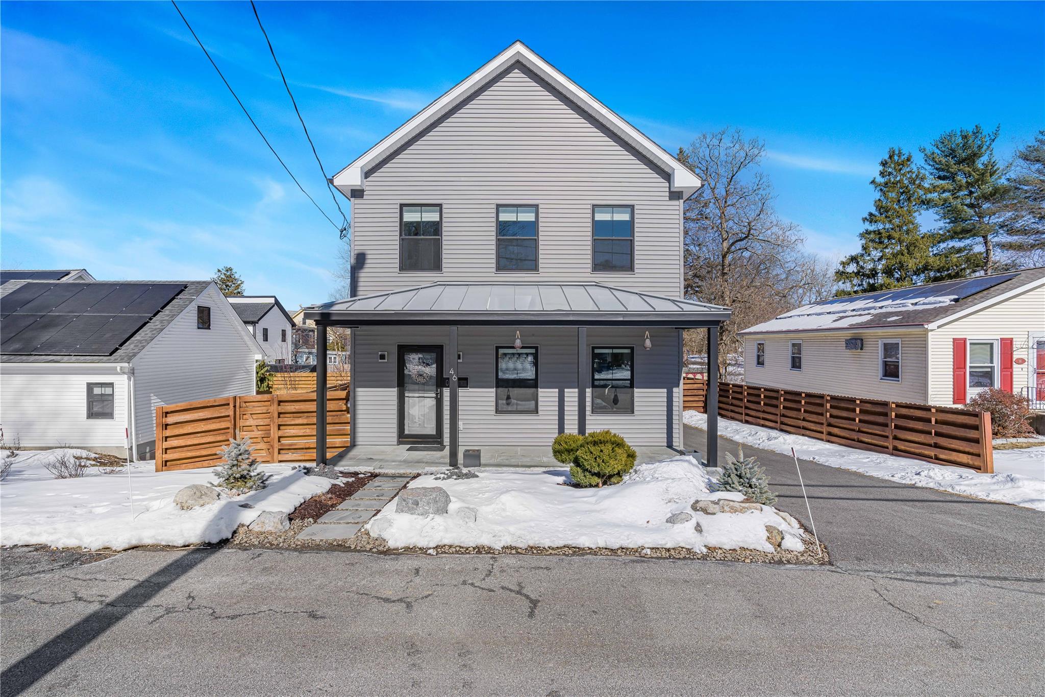 a front view of a house with a patio