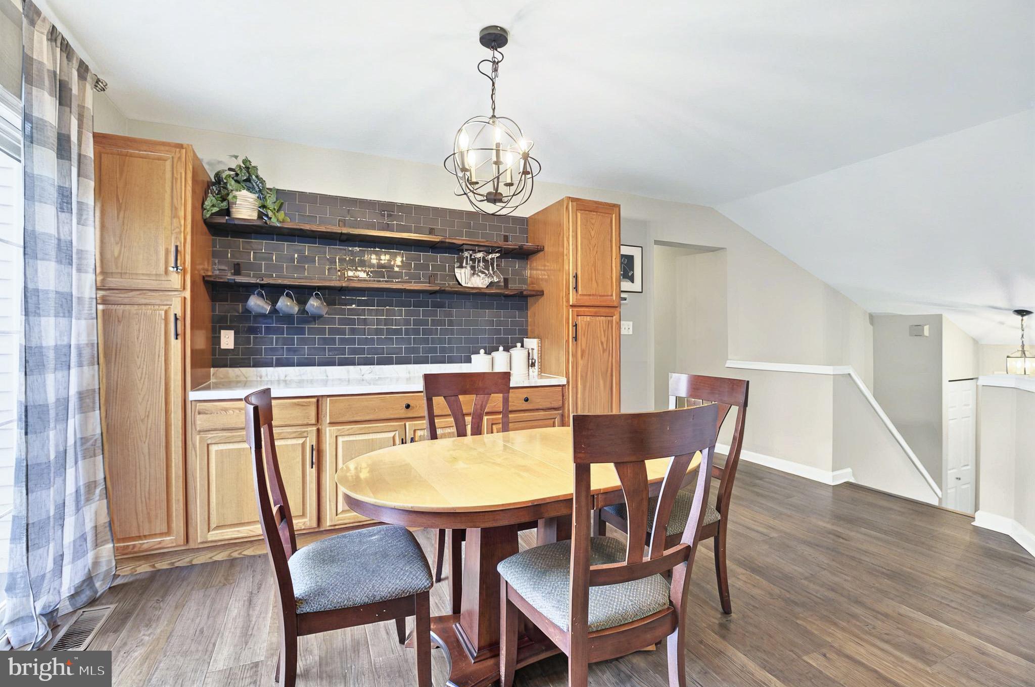 20 Pebble Creek Drive Lititz, PA 17543 - Photo 11 of 45 a view of a dining room with furniture and wooden floor