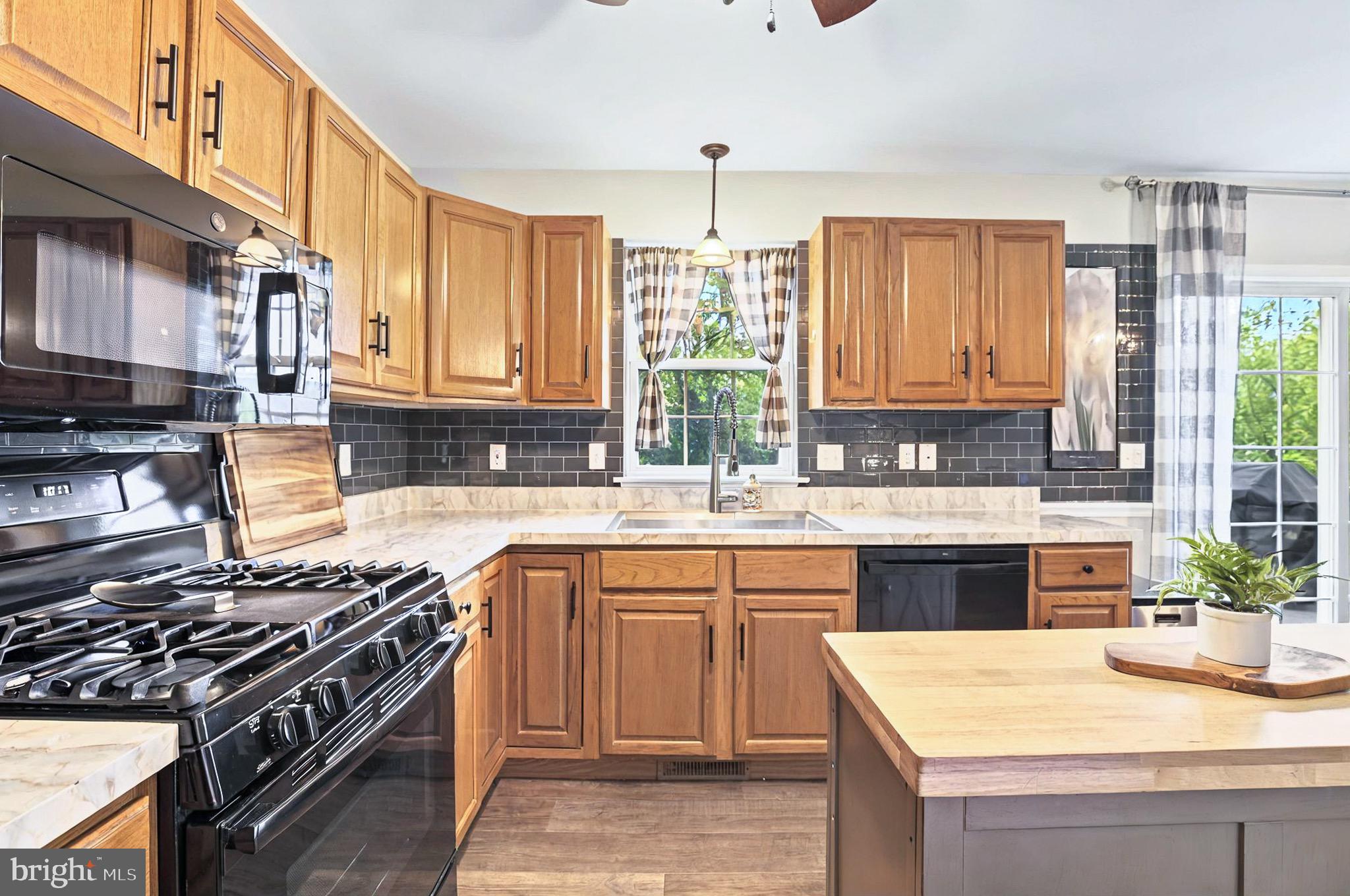 20 Pebble Creek Drive Lititz, PA 17543 - Photo 15 of 45 a kitchen with a sink stove top oven and cabinets