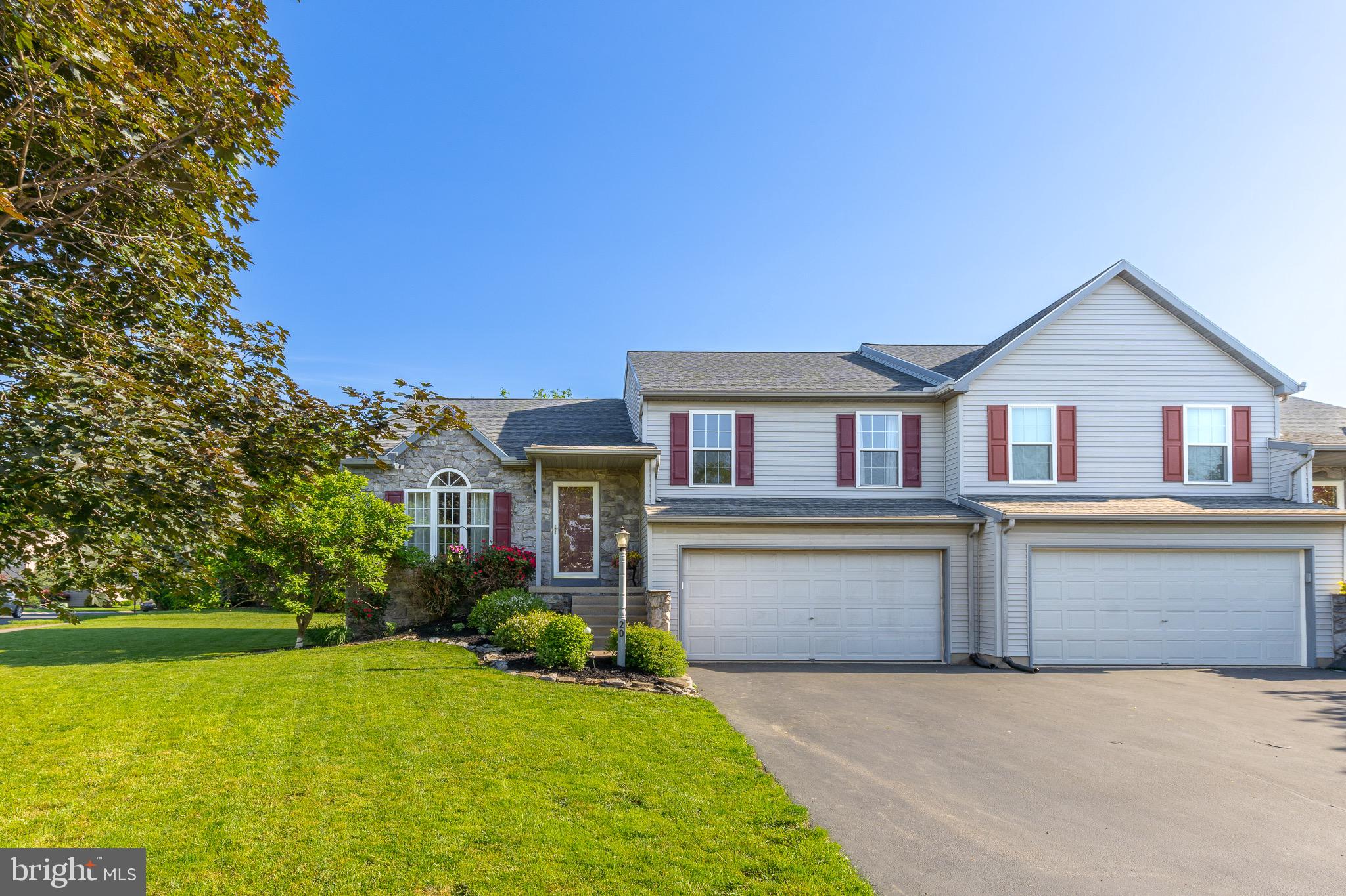 20 Pebble Creek Drive Lititz, PA 17543 - Photo 2 of 45 a front view of house with yard and trees in the background