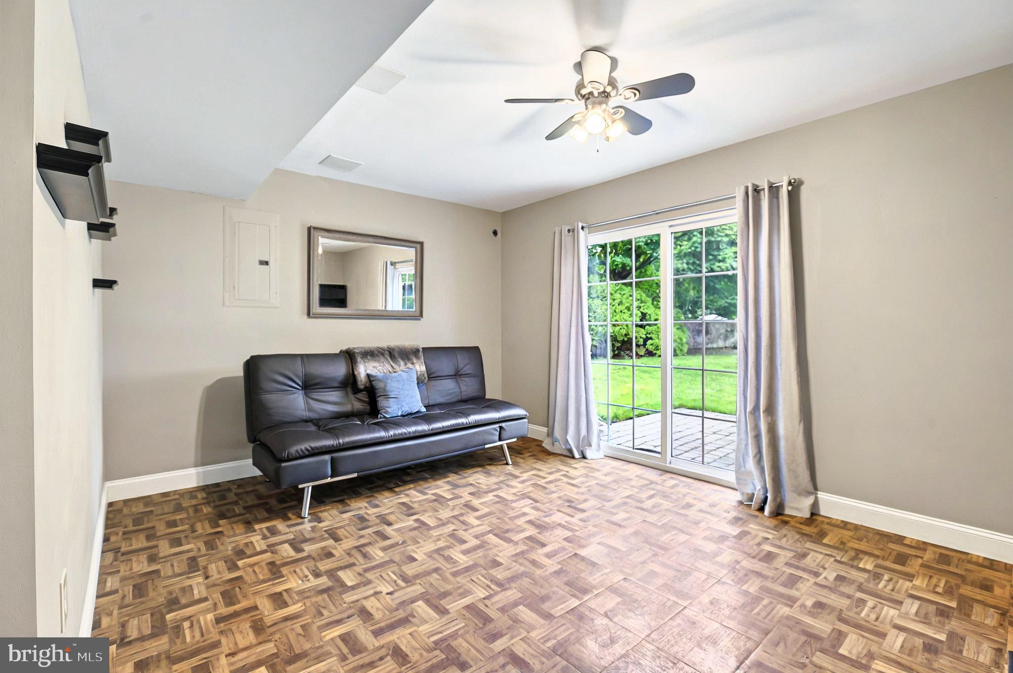 20 Pebble Creek Drive Lititz, PA 17543 - Photo 27 of 45 a living room with a couch and a chandelier