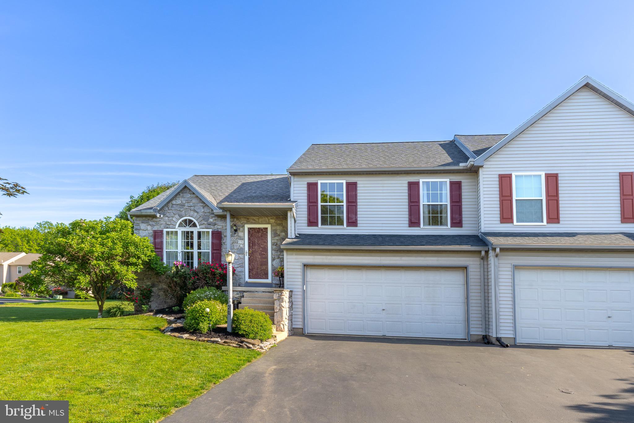 20 Pebble Creek Drive Lititz, PA 17543 - Photo 3 of 45 a front view of a house with a yard and garage
