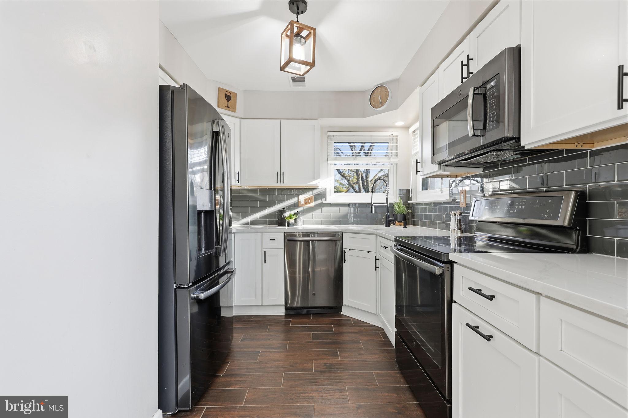 2 Heather Court Newtown, PA 18940 - Photo 14 of 34 a kitchen with stainless steel appliances granite countertop a sink and a stove
