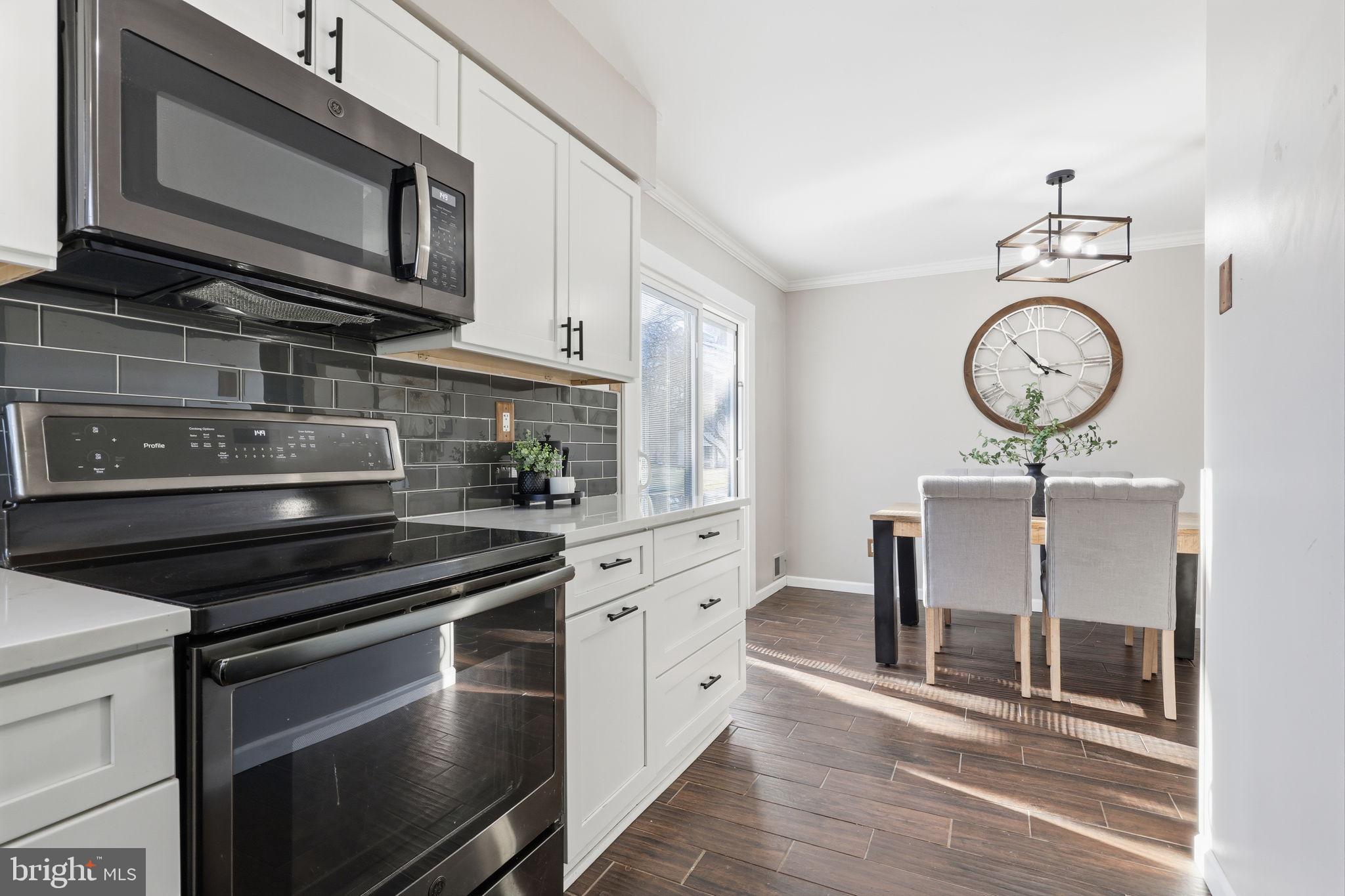2 Heather Court Newtown, PA 18940 - Photo 16 of 34 a kitchen with stainless steel appliances a stove a microwave and cabinets