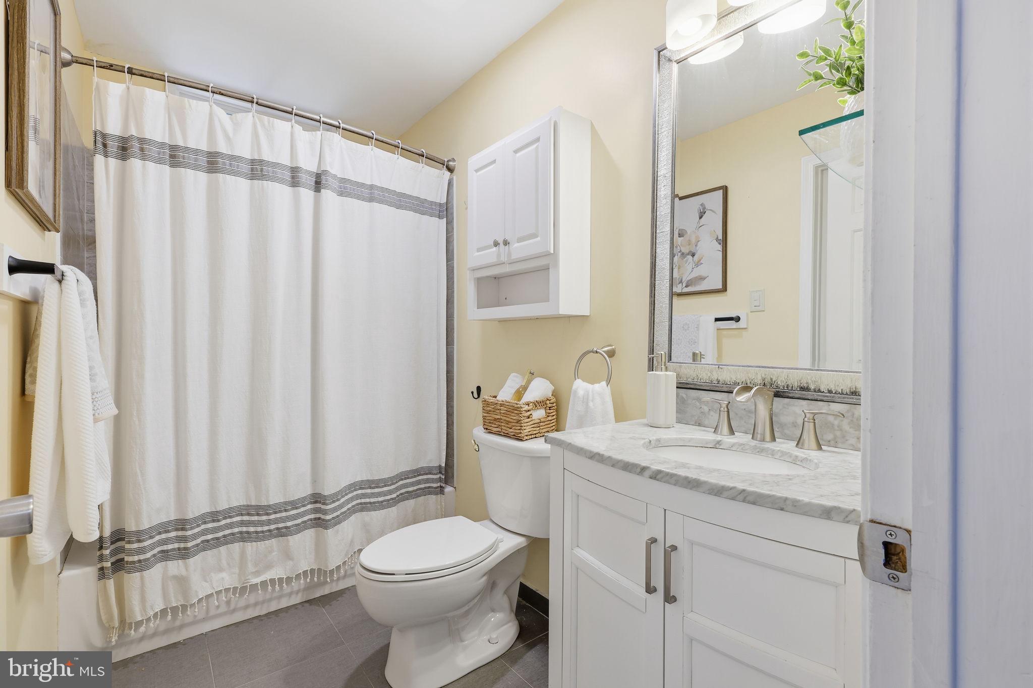 2 Heather Court Newtown, PA 18940 - Photo 20 of 34 a bathroom with a granite countertop sink and a mirror