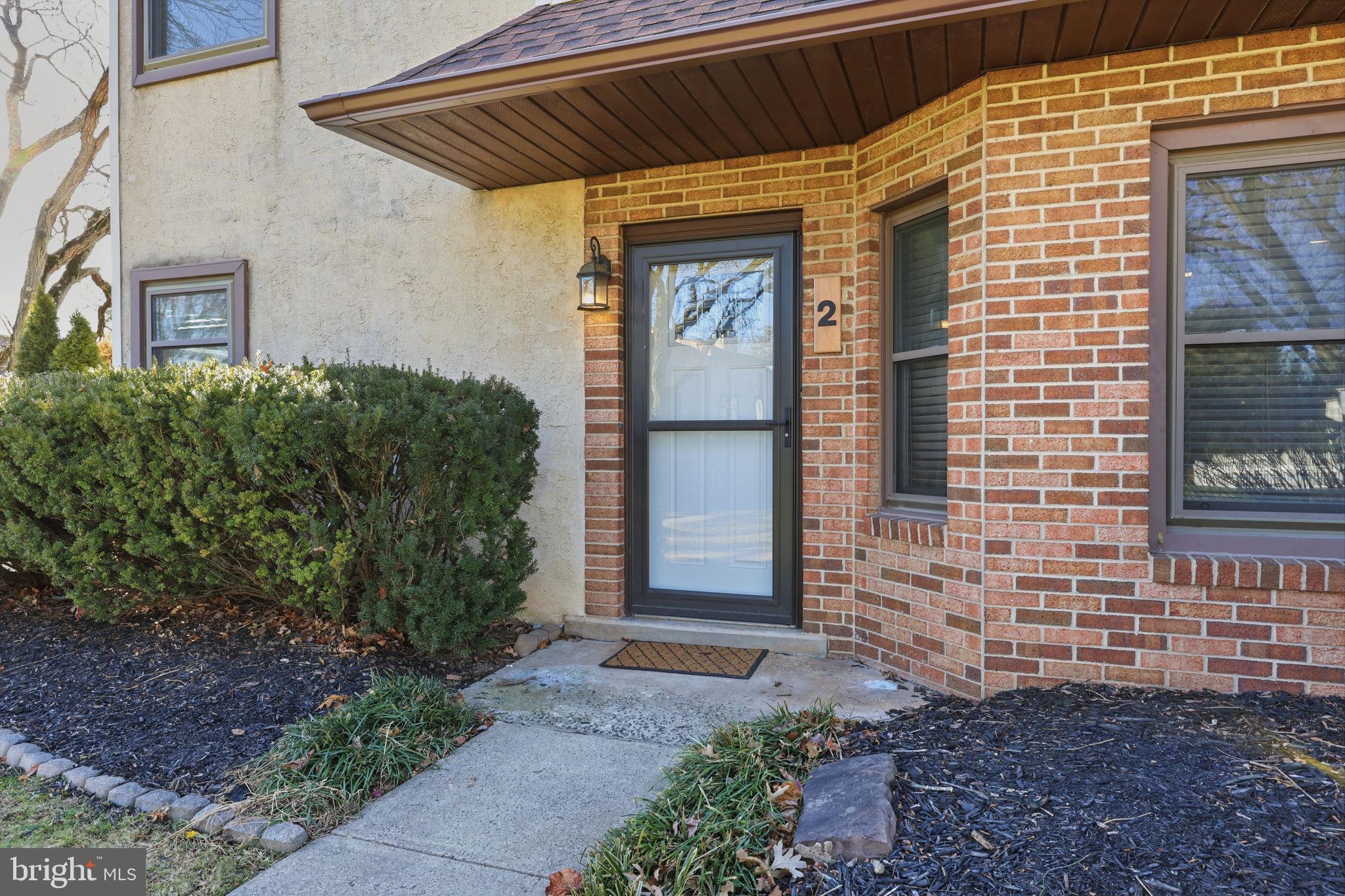 2 Heather Court Newtown, PA 18940 - Photo 4 of 34 a front view of a house with garden