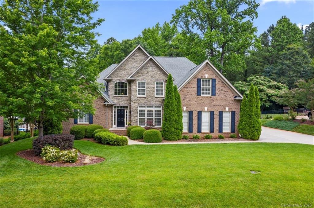 142 Spring Branch Road Fort Mill, SC 29715 - Photo 1 of 48 a front view of a house with a yard and trees