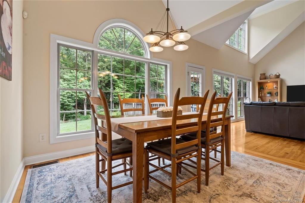 142 Spring Branch Road Fort Mill, SC 29715 - Photo 12 of 48 a view of a dining room with furniture window and wooden floor