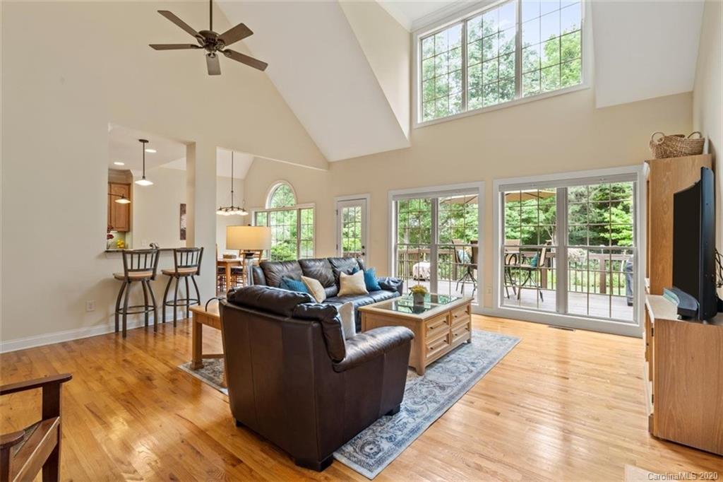 142 Spring Branch Road Fort Mill, SC 29715 - Photo 15 of 48 a living room with furniture large windows and wooden floor