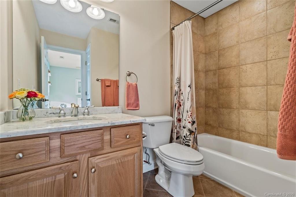 142 Spring Branch Road Fort Mill, SC 29715 - Photo 27 of 48 a bathroom with a sink a toilet and shower