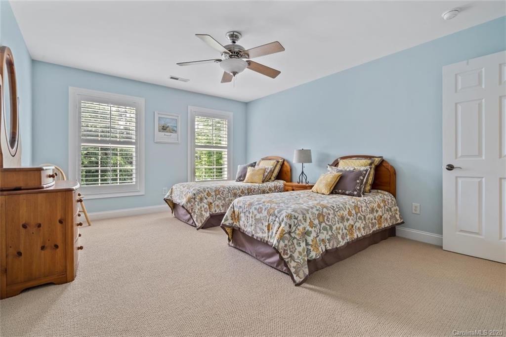 142 Spring Branch Road Fort Mill, SC 29715 - Photo 28 of 48 a bedroom with two beds and ceiling fan