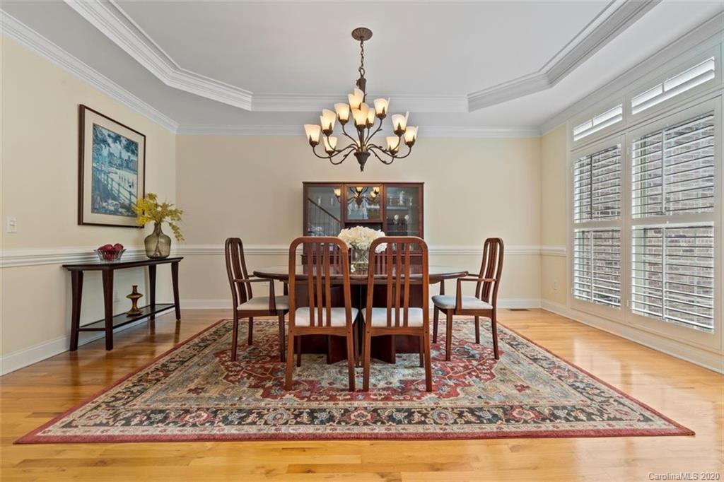 142 Spring Branch Road Fort Mill, SC 29715 - Photo 5 of 48 a view of a dining room with furniture a rug and wooden floor