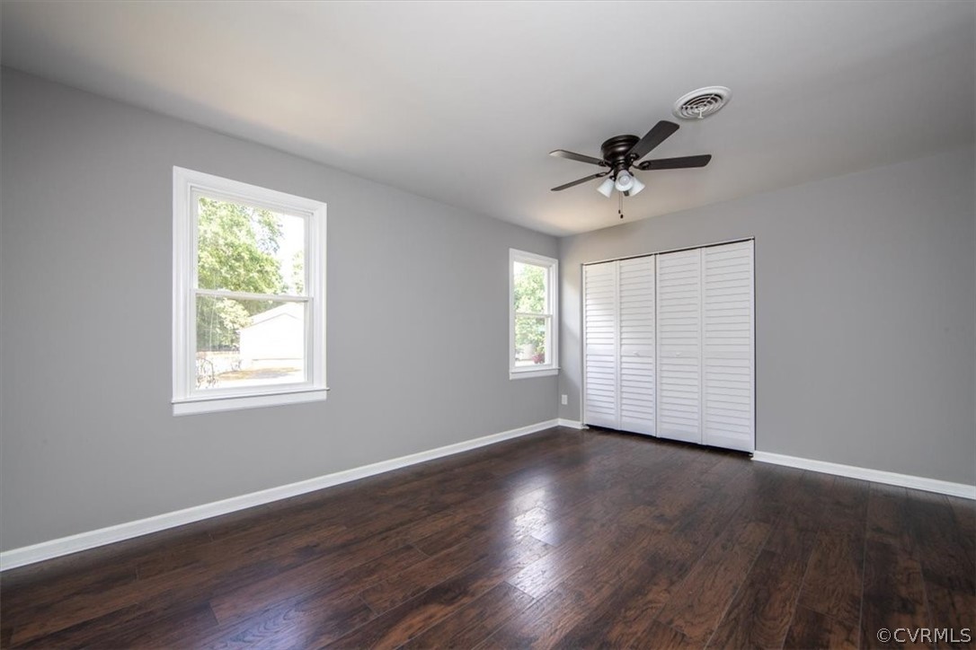 9301 Telstar Drive Richmond, VA 23237 - Photo 13 of 24 a view of an empty room with wooden floor and a window