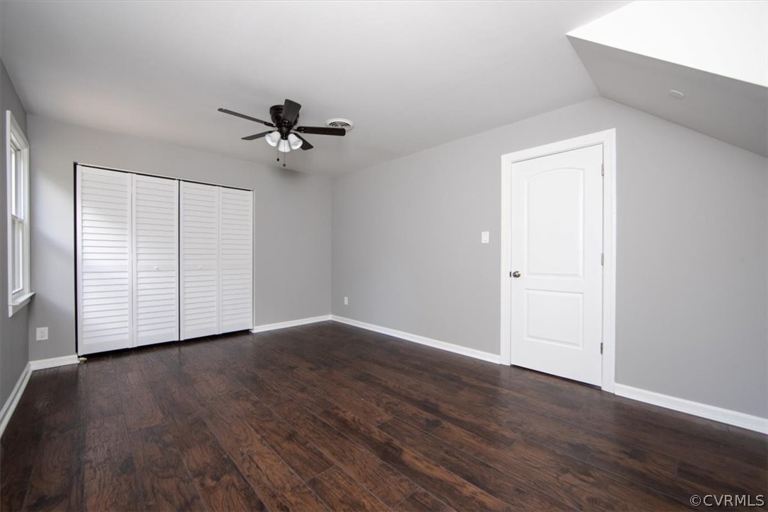 9301 Telstar Drive Richmond, VA 23237 - Photo 14 of 24 an empty room with wooden floor ceiling fan and windows
