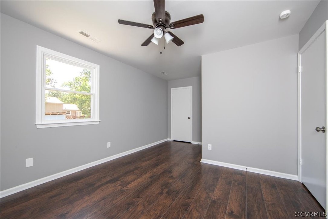 9301 Telstar Drive Richmond, VA 23237 - Photo 17 of 24 a view of an empty room with window and wooden floor
