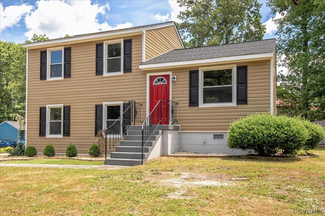 9301 Telstar Drive Richmond, VA 23237 - Photo 3 of 24 a view of a house with more windows and plants